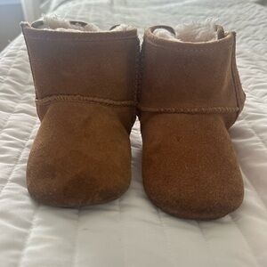 Toddler brown uggs with light pinks bows, gently worn. Size 4/5